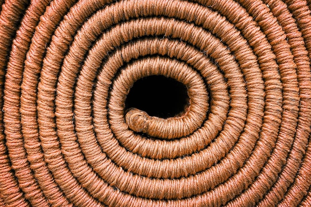 Tapis enroulé texture de tapis en spirale de couleur orange en gros plan
