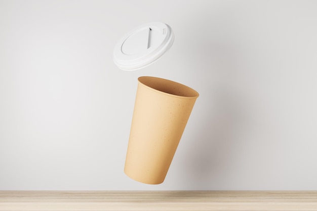 Tasse à café à emporter jaune vide sur fond blanc et surface en bois Publicité et concept de maquette Rendu 3D