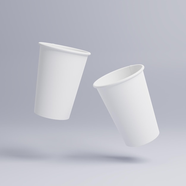 Tasses de café en papier blanc maquettes sur fond blanc Couvercle de tasse blanche Deux tasses dans l'air dynamique