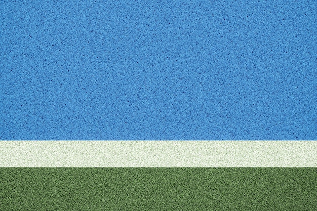 Un terrain de football bleu avec une ligne blanche qui dit "la ligne blanche".