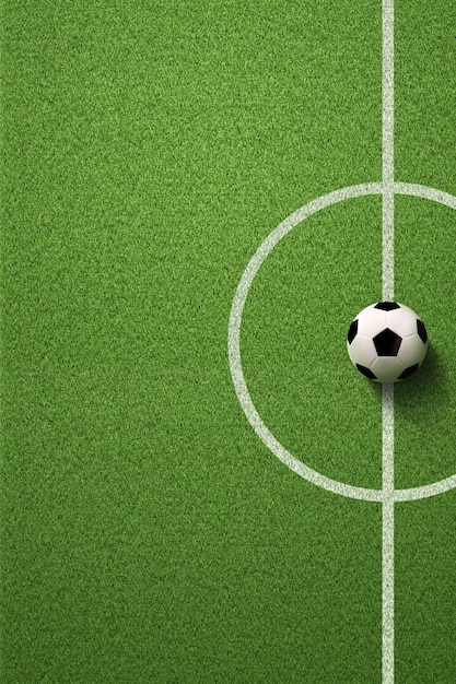 Terrain de football ou terrain de football avec ballon de football sur fond d'herbe verte