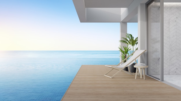 Terrasse près du salon et de la piscine dans maison de plage moderne ou villa de luxe