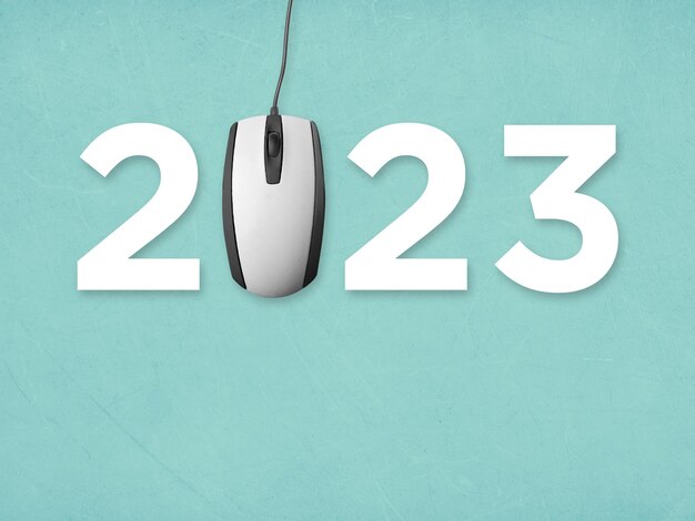 Texte 2023 avec les salutations du nouvel an de la souris d'ordinateur et le concept de souhait du nouvel an