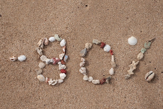 Texte 80 % sur du sable fabriqué à partir de coquillages