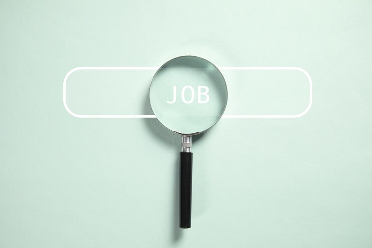 Photo le texte de l'emploi avec une loupe.