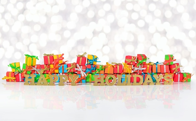Photo texte d'or de joyeuses fêtes sur fond de cadeaux multicolores sur fond flou
