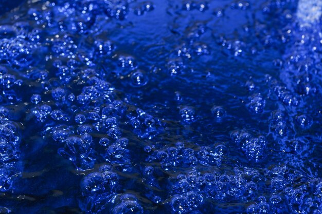 Texture abstraite art bleu fond d'eau avec des bulles d'air en gros plan macrophotographie