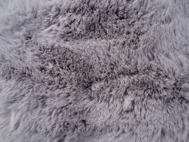 Texture abstraite de fourrure artificielle, motif de détail de scène macro de fourrure grise, imitant la nature.