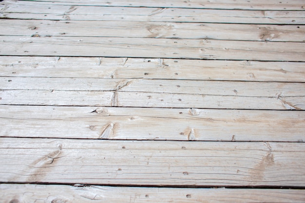 Texture en bois. Un fond des vieilles planches grises se trouvant dans une rangée