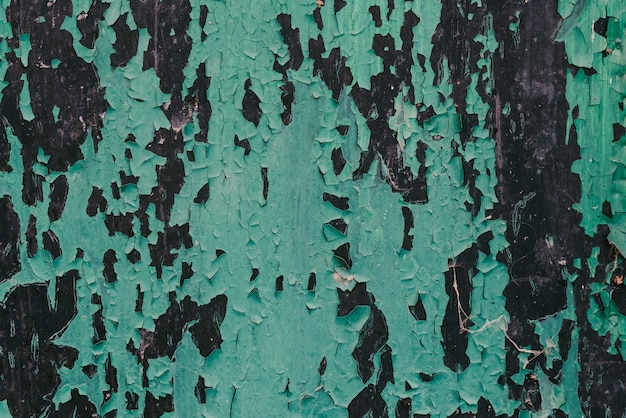 Texture de bois peint vert Conseil noir avec des fissures