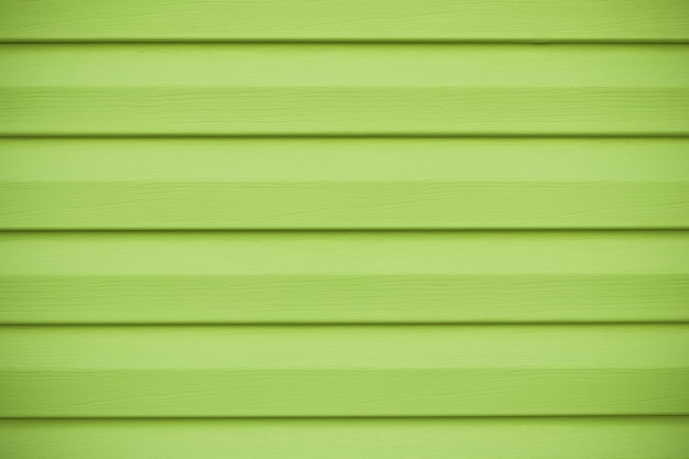 Texture en bois vert à rayures horizontales. Planche de couleur citron vert, mur jaune en lignes.
