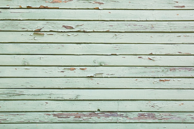 Texture en bois avec de la vieille peinture bleue fissurée