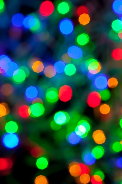 Texture bokeh des lumières multicolores de Noël et du nouvel an