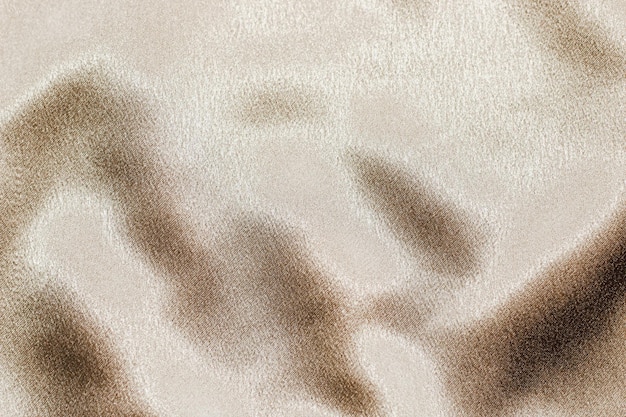 Texture brillante dorée de satin satin de soie avec plis