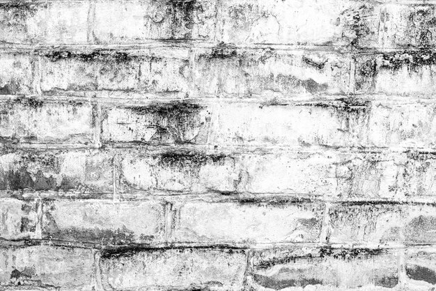 Texture, brique, fond de mur. Texture de brique avec rayures et fissures