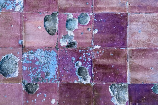 Photo texture de carreaux fissurés colorés carreaux divisés fond de sol ou de mur vintage ancien
