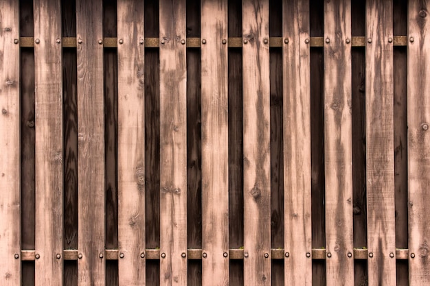 Texture d&#39;une clôture en bois faite avec fond de planches