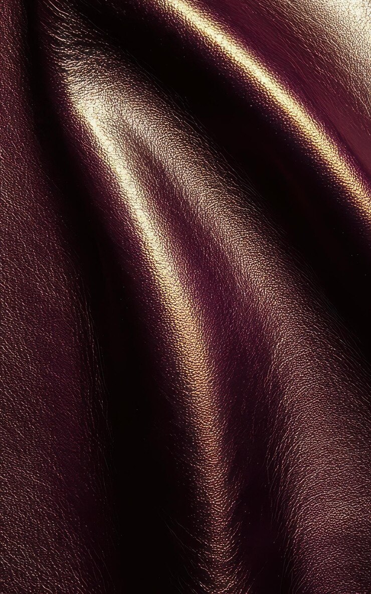 Photo texture de cuir lisse de couleur marron et or