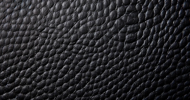 Une texture de cuir noir avec un motif texturé.