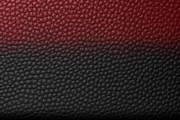 Texture en cuir rouge et noir avec un fond noir