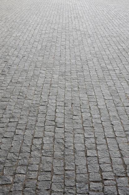 La Texture De La Dalle (pavés) De Nombreuses Petites Pierres De Forme Carrée Sous Un Soleil éclatant