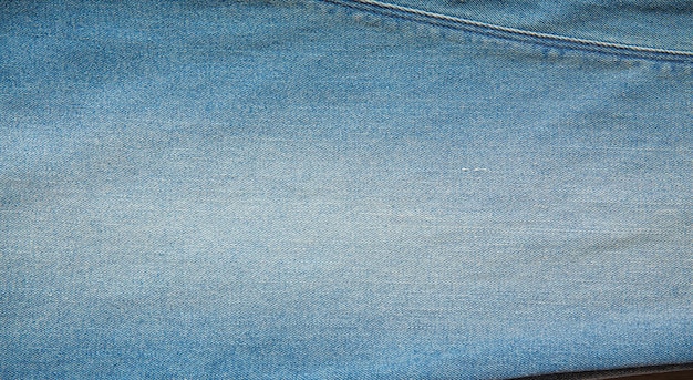 La texture denim bleu peut être utilisée comme arrière-plan