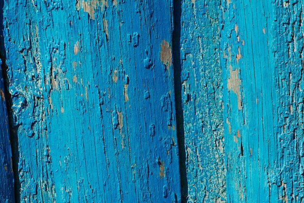 La texture du bois de la porte bleue vieillie fond méditerranéen