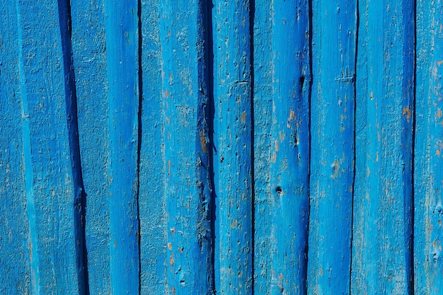 La texture du bois de la porte bleue vieillie fond méditerranéen