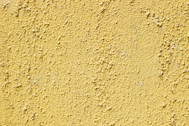 Texture du mur jaune du revêtement de plâtre.