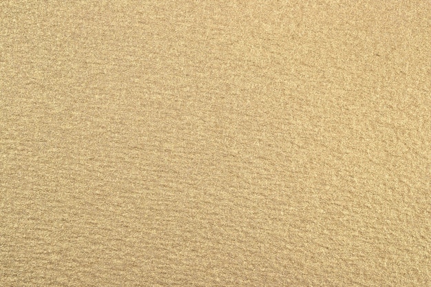 La texture du papier doré en arrière-plan