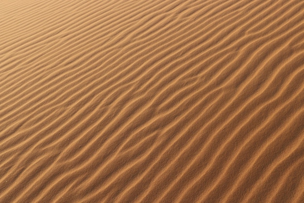 Texture du sable fond du désert dunes de sable dunes de sand avec vague de