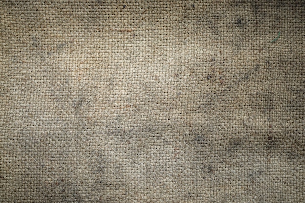 La texture du sac de toile de jute sale peut être utilisée comme arrière-plan