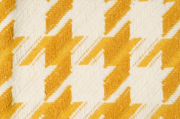 Photo texture du tissu au lait jaune tricoté en gros plan sous un angle le concept de matériaux pour la couture et la fabrication de produits image pour votre conception