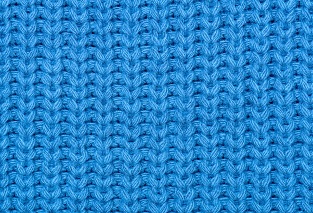 La texture du tricot en bleu.