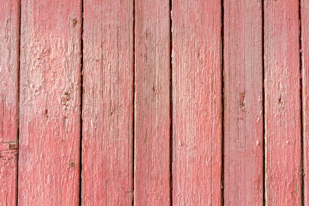 Texture du vieux bois avec de la peinture rose usée