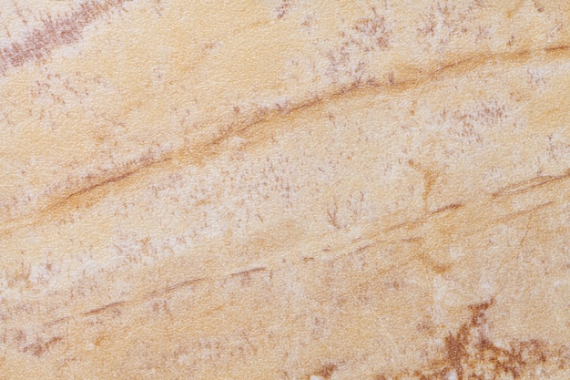 Texture du vieux marbre beige avec motif craquelé, fond macro.