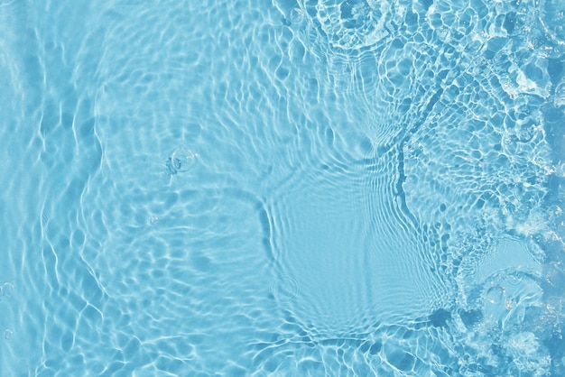 Photo texture de l'eau de fond de surface de l'eau bleue avec des éclaboussures et des bulles fond de nature d'été