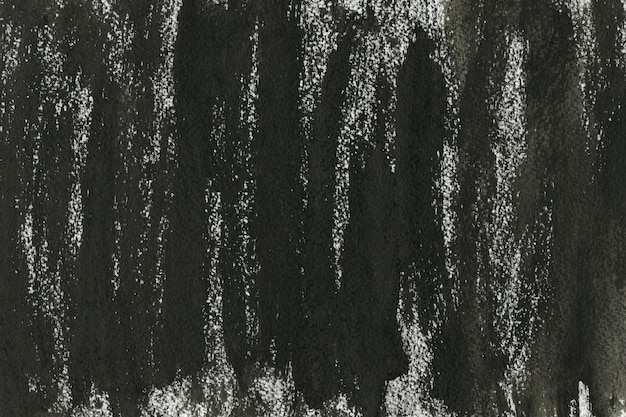 Texture d'encre noire peinte sur fond de papier aquarelle