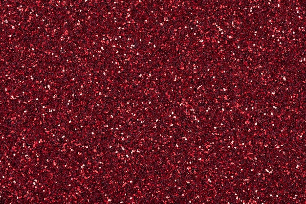 Texture étincelante dans un admirable ton rouge foncé pour le design de Noël