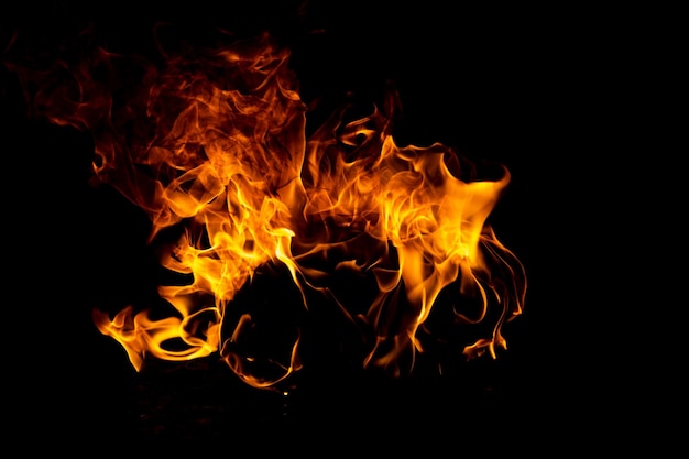 La texture de la flamme du feu pour le fond de la bannière brûle des lumières abstraites