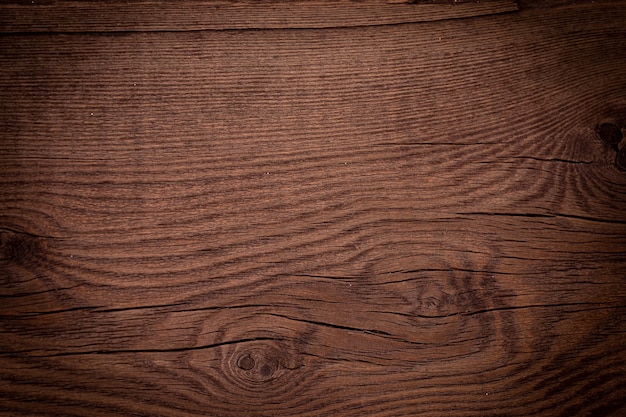Texture de fond en bois brun vintage avec des noeuds