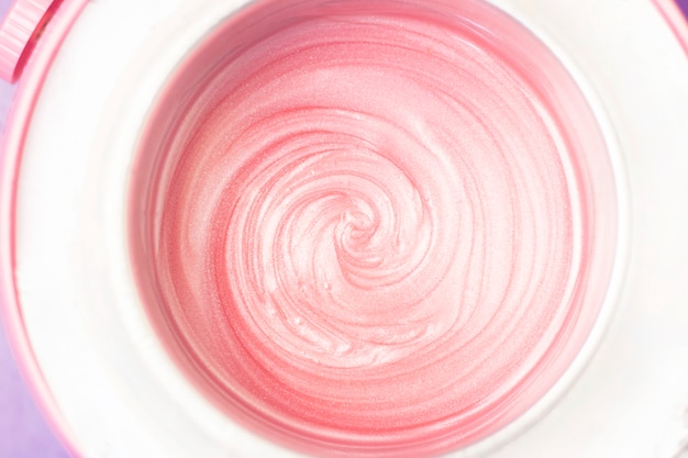 Texture de fond cire liquide pour épilation de couleur rose.