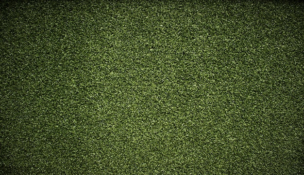 Texture de fond d'herbe verte artificielle.