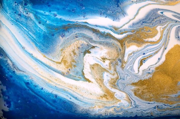 Texture de fond liquide en marbre de style océan bleu et or
