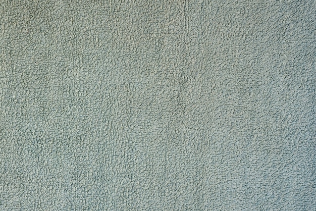 Texture de fond lisse d'une serviette éponge. Couleur turquoise