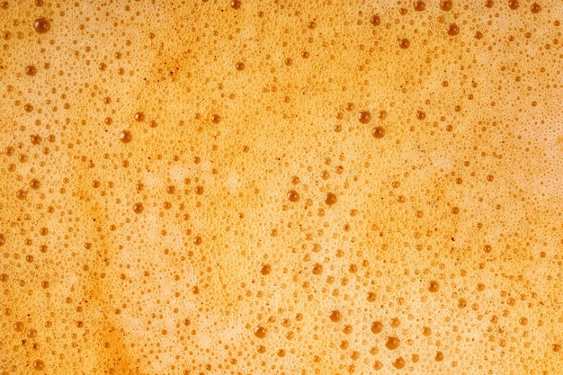 Texture de fond de mousse de lait de café de cappuccino macro gros plan