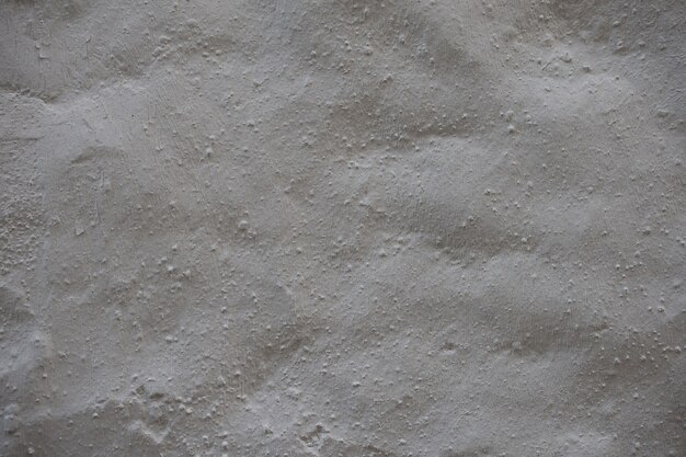 Texture de fond de mur de béton gris avec du plâtre. vieux fond de texture de mur de ciment