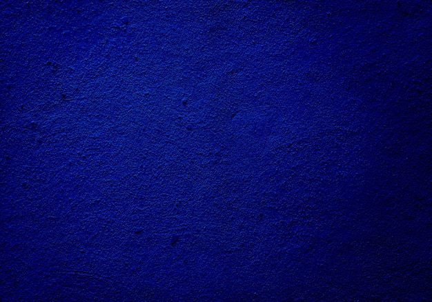 Texture ou fond de mur bleu grainé