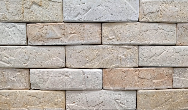 Texture de fond de mur de brique beige bouchent