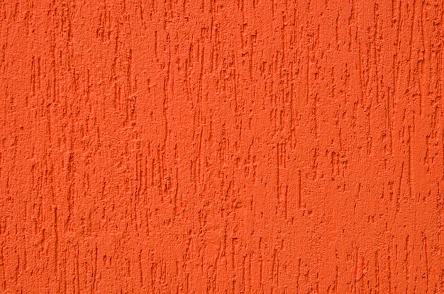 Texture de fond mur de plâtre rouge orange vif